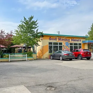 cars parked in front of a restaurant