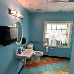 a bathroom with a toilet and sink
