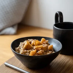 a bowl of oatmeal and a cup of coffee
