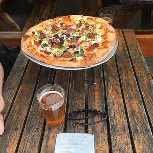 Vegetarian pizza with Italian sausages. Just right charred on the bottom. Authentic !