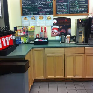 a coffee shop with menus on the wall