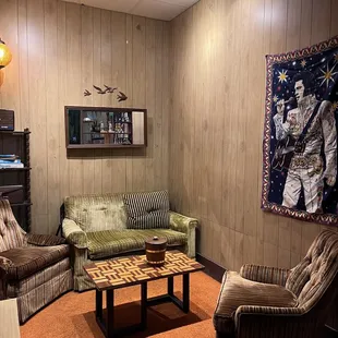 a living room with couches and a rug