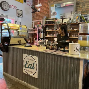 a woman behind the counter