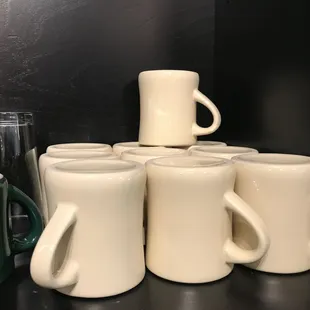 a stack of coffee mugs