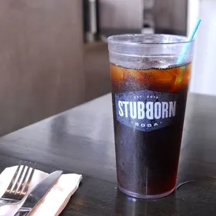  glass of soda and a fork
