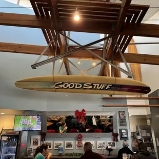 Inside seating featured booths and tables with a beach decor.