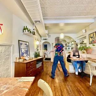 a woman walking through a restaurant