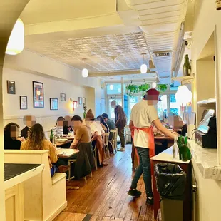 a restaurant with people sitting at tables