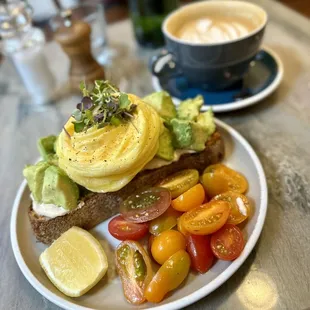 Avocado toast with scrambled egg and cherry tomatoes