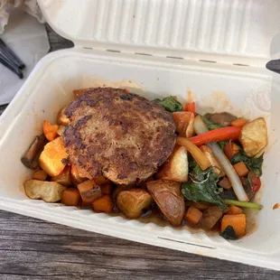 a meal in a styrofoam container