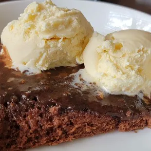 a slice of chocolate cake with ice cream