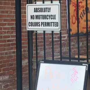 a sign in front of a building