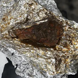 a piece of steak wrapped in foil