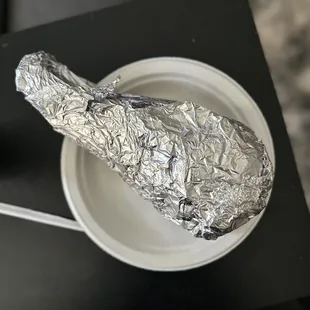 a wrapped chicken on a plate