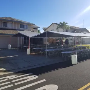 (2) 20x40 canopies with tables and chairs and water barrels to anchor