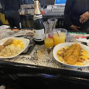Catfish and grits and salmon Crocketts with scrambled eggs and rice. Plus mimosas!