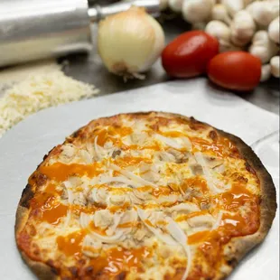 a pizza with cheese and onions