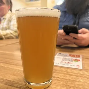 a glass of beer on a table