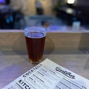 a glass of beer on a table