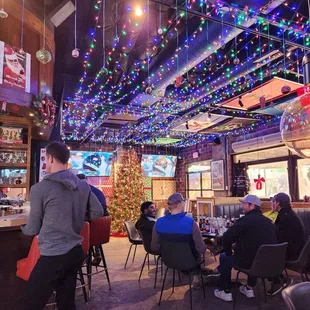 a restaurant decorated with christmas lights