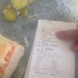 Our receipt w/order and the pickles that came on it. The peppers were mentioned twice in my order but none came on my sammy