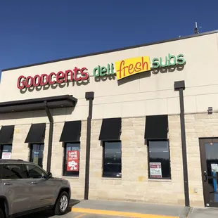 a car parked in front of a restaurant