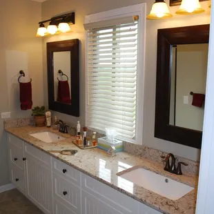a bathroom with two sinks