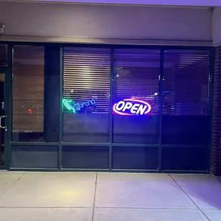 Clearly a sign that says Open, come inside!