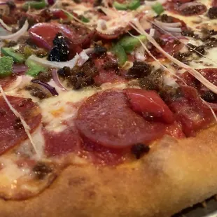 Large combo pizza fresh out of the oven