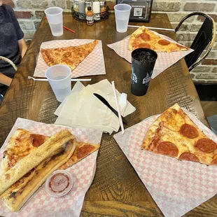 Four slices of pizza take up a lot of the table