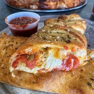 two pizzas on a table