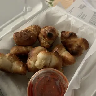 Burnt garlic knots covered with cheese after I specifically asked for none This was part of my replacement