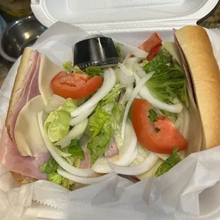 Combo sub with tomatoes thicker than the sun itself