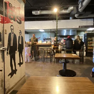 Seating room with a mural of Reservoir Dogs in the freezer