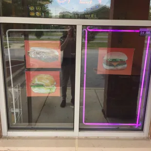 a man taking a selfie in a window