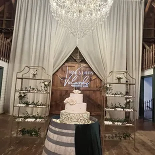 3 tier wedding cake &amp; desserts on shelves (venue Springville Ranch)