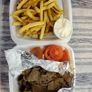 a meal in a styrofoam container