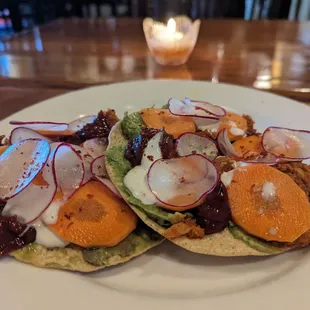 Tostada with tuna with chorizo, guac, crema and some vegs. Good flavor, but the texture of the tuna and chorizo could have been less mushy.