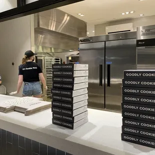 people in the kitchen preparing cookies