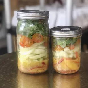 two jars of food on a table