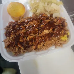 Pulled chicken over rice, Cabbage,  corn bread muffim