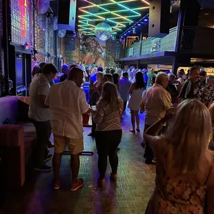 a crowd of people at a bar