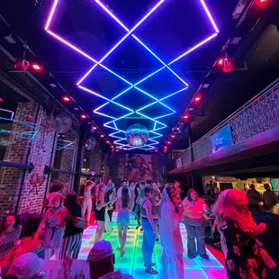 a dance floor with neon lights
