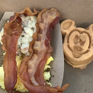 Scrambled eggs, bacon, potato casserole and Mickey Waffle