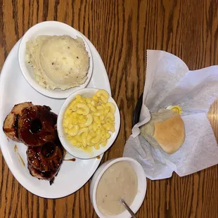 Tropicana chicken with mashed potatoes and gravy and macaroni and cheese