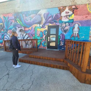 Outside the shop, awesome handicap ramp and Muriel.