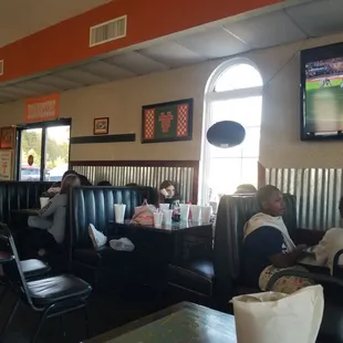 a group of people sitting in a restaurant