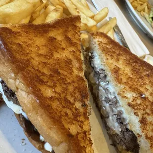 Melt, hamburger, mushrooms and Swiss with fries