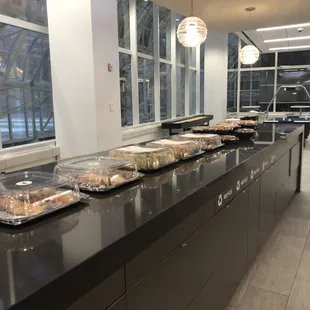 a long line of trays of food