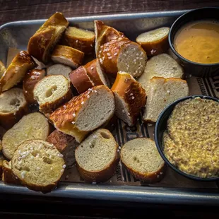 Dry nasty pretzel bites with enough beer cheese for maybe two.